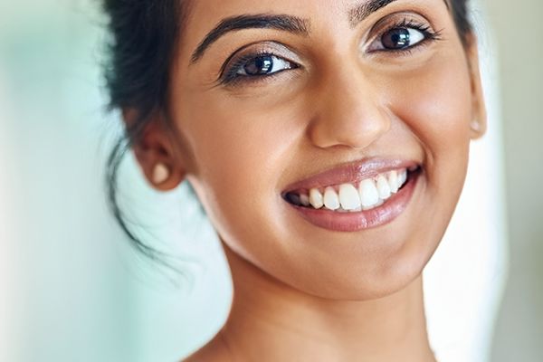 Patient with beautiful smile after veneers