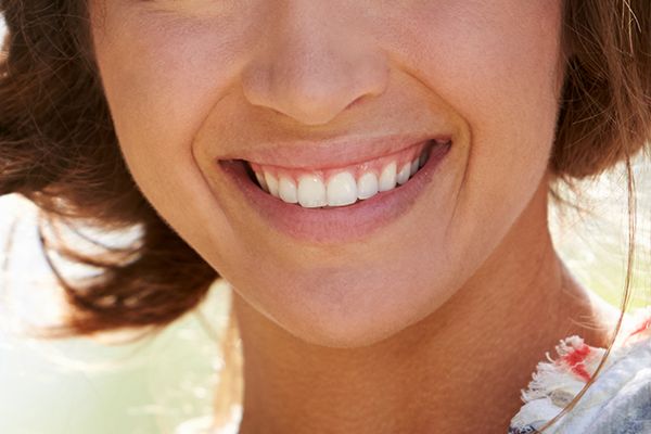 Patient with bright smile after teeth whitening